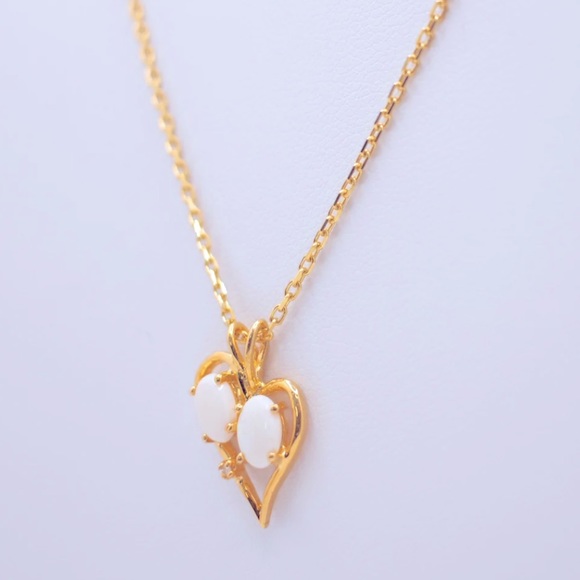 14K Heart pendant with opal stones paired with a necklace. - Picture 2 of 3